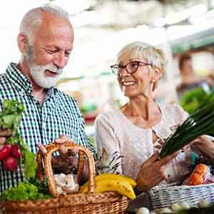 older couple shopping for healthy food together