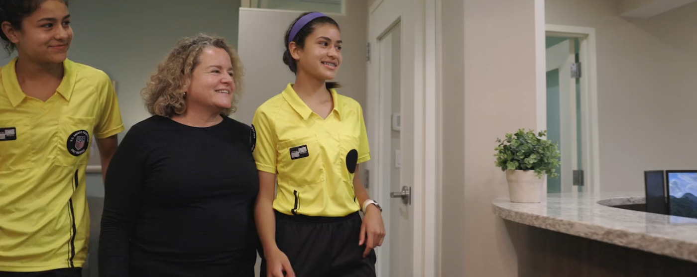 Three smiling women in North Attleboro dental office