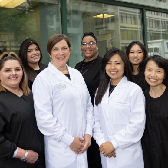 Smiling dentists and team members at Newton Corner Dental Care