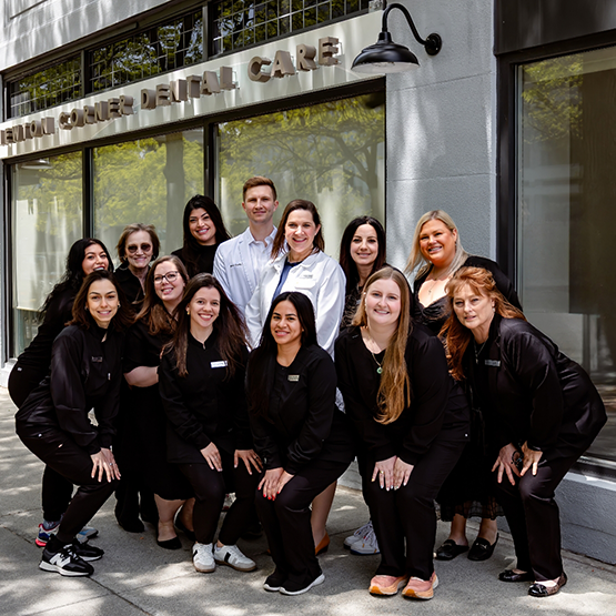 Smiling dentists and team members at Newton Corner Dental Care