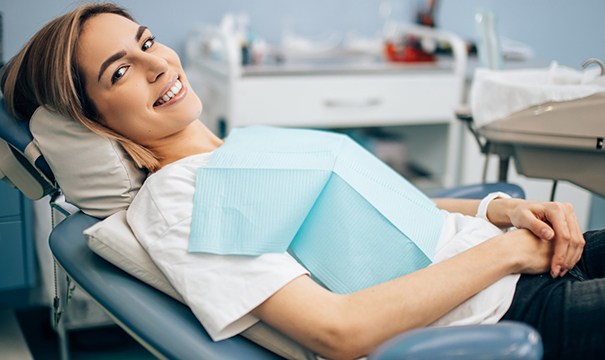 Woman sitting back in chair at dentist’s office